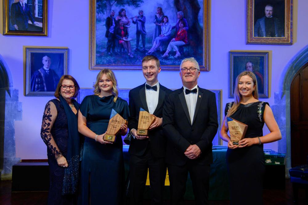 Graduate of the year and Peel Awardees stand with their trophies