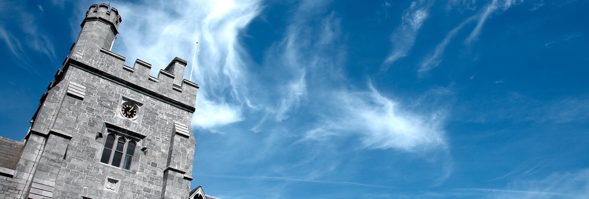 the UCC Tower against a blue sky