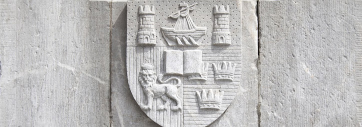 ucc-banner-stone-crest