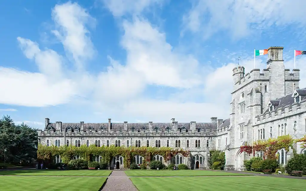 The UCC Quadrangle with blue sky surrounding it