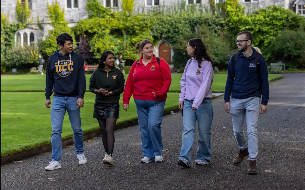 Postgraduate Students walk along the main quad