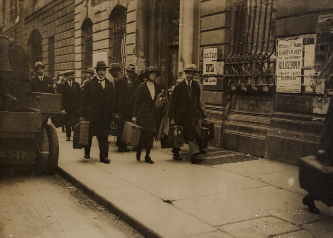 Guests leaving the Edinburgh Hotel, O'Connell Street, Dublin where they had been confined for three days during fighting, 5 July 1922 NLI HOGW 27