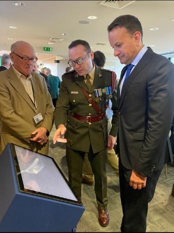 Comdt Ayiotis, Leo Varadkar and Tony Kinsella examining the Military Archives National Army Fatalities Roll, 1922 – 1923