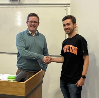Geoffrey Stosse being presented with his prize from Dr Thomas Brouder, Eli Lilly Geoffrey Stosse being presented with his prize from Dr Thomas Brouder, Eli Lilly