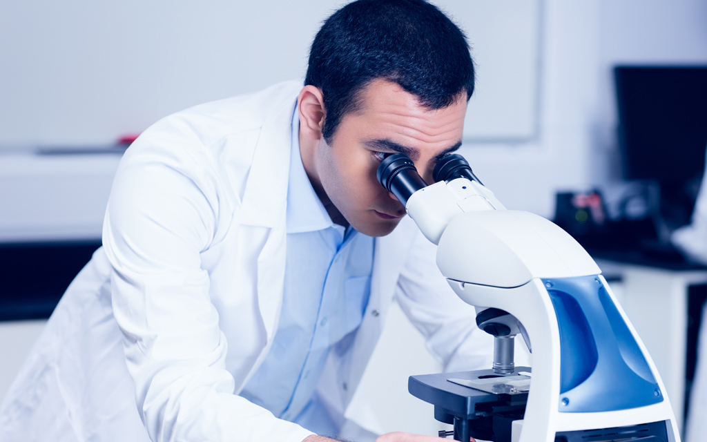 Male research student in a laboratory