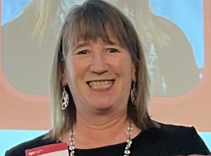 A woman smiling at the camera