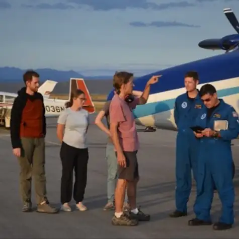 Dr Steven Brown with colleagues outside an aeroplane for atmospheric research