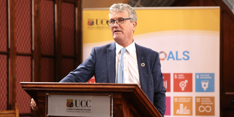 Professor John O'Halloran speaking at a podium