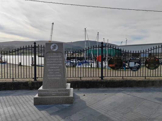 An Irish Great Famine monument by a port An Irish Great Famine monument by a port