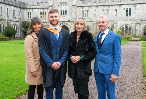 PG Cert Graduation Damien O'Gorman and family outside the Quad