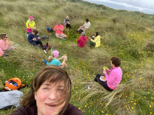 FITU Walk July 2022 group sitting on grass