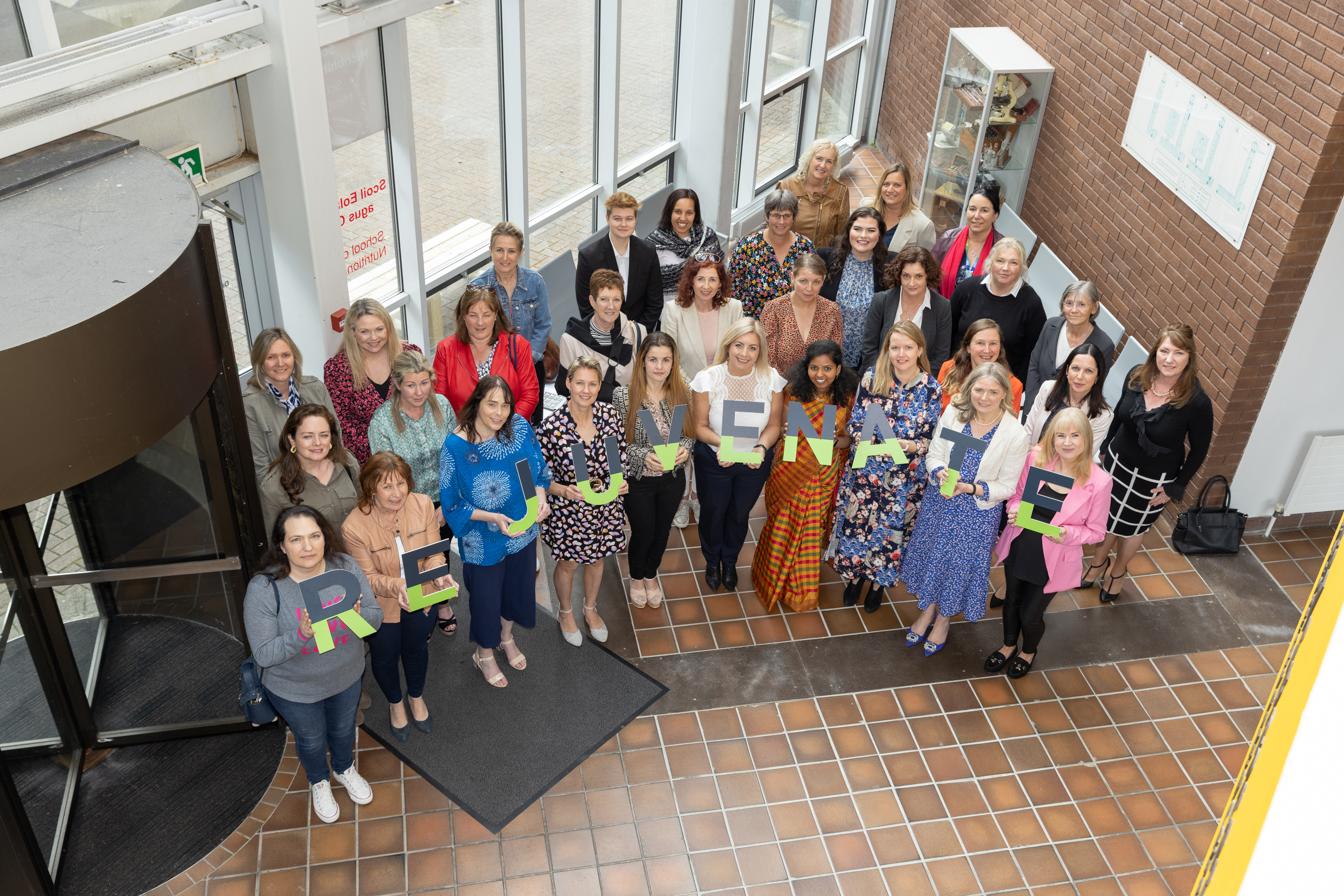 Rejuvenate Graduation - group in atrium UCC