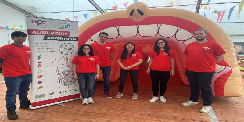 People in front of inflatable gut