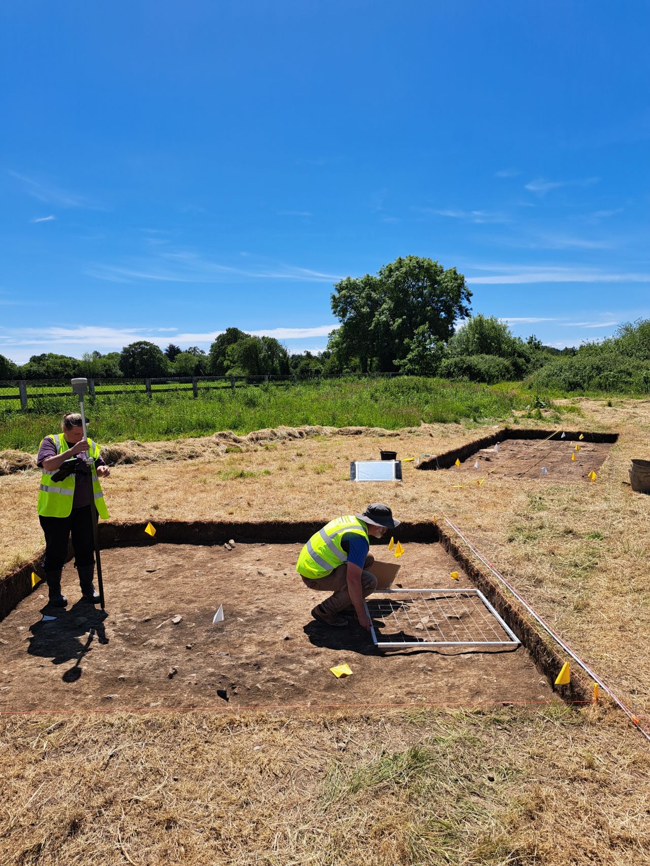 Woodstown Excavation site with archaeologists at work digging in the ground Woodstown Excavation site with archaeologists at work digging in the ground