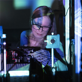 Female researcher in a Photonics laboratory