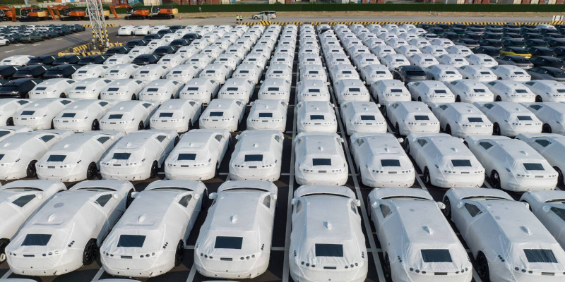 Electric vehicles bound for shipment at a port in China. Bloomberg