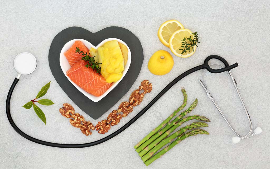 Plate of food and medical instruments illustrating the concept of food microbiome and health