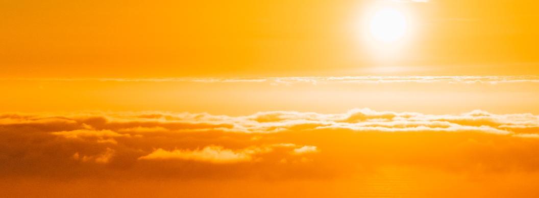 yellow sun above clouds