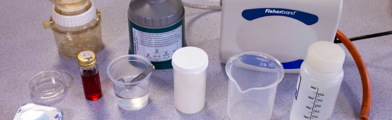 Chemicals on a laboratory workbench.