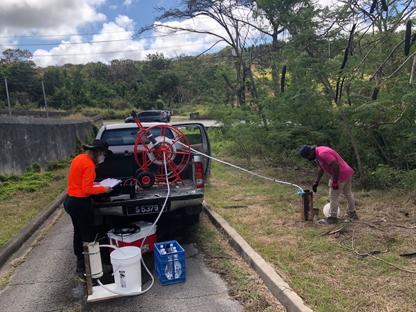 Groundwater sampling at monitoring boreholes in Barbados.