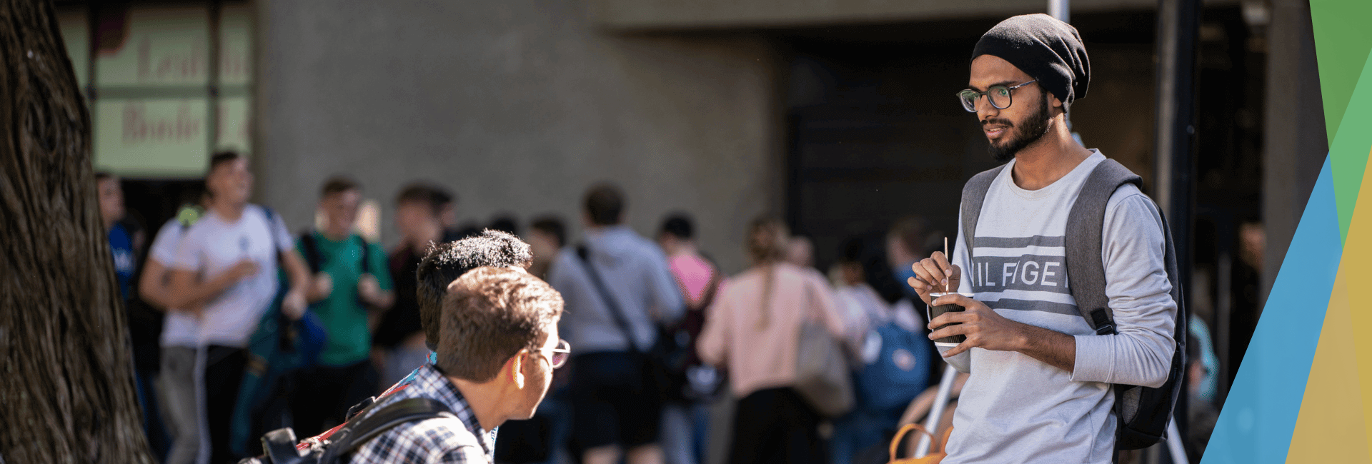 Two male students talking on campus