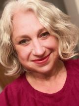 Headshot of fair-haired student smiling for the camera.