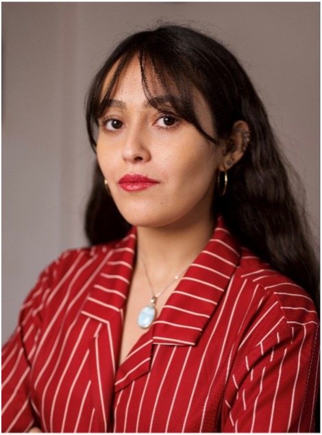 Headshot of student with long dark hair wearing a red and white striped blouse.