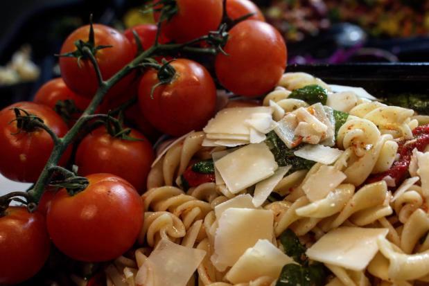 cherry tomatoes on a bed of pasta