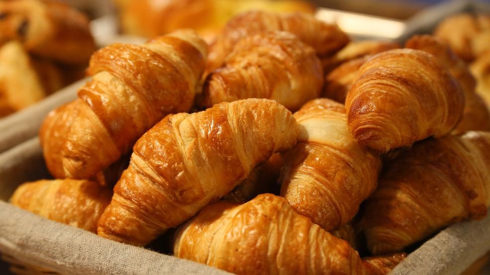 a load of croissants on a tray