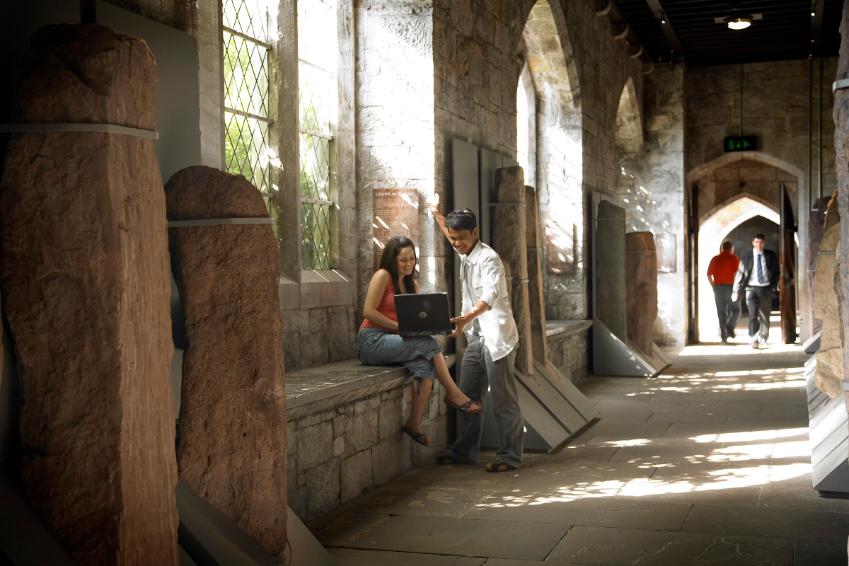 UCC stone corridor, two people chatting UCC stone corridor, two people chatting