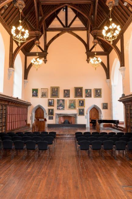 A long shot of the Aula Maxima showing the Presidents' Wall