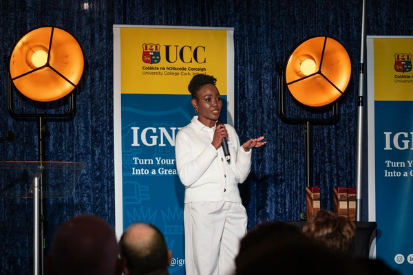 Image of a person standing a presenting to an audience