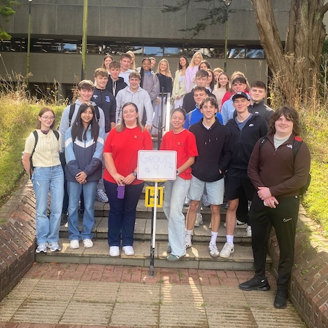 Peer support & students posing in front of the Boole Library