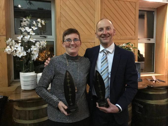 Christine O'Donovan and Trevor Wood with their UCC long service awards