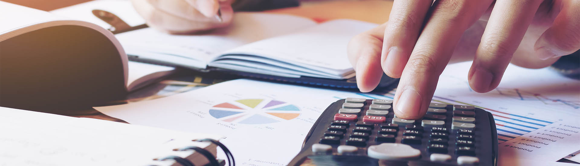 A person budgets with a calculator