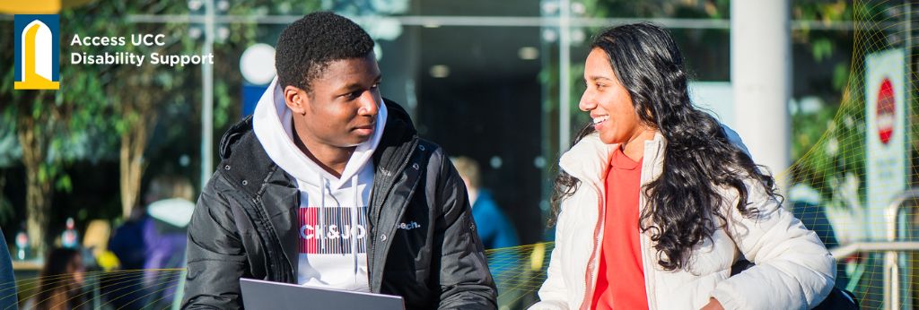 Disability Support Decorative Banner | Two students talking outside the student Centre