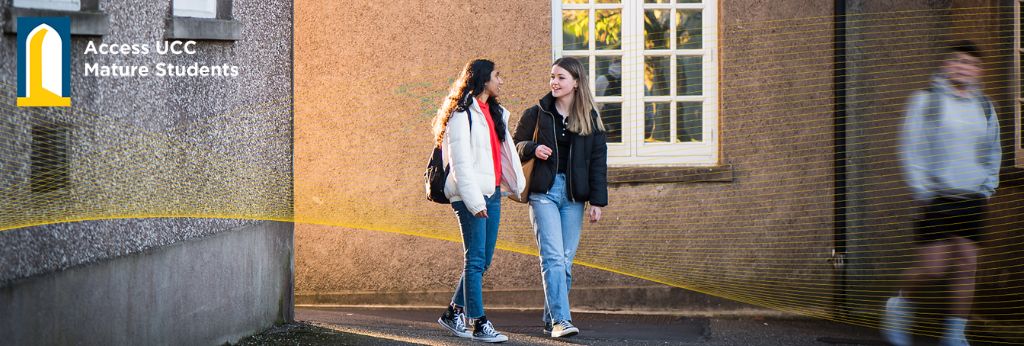 Mature Student Support Decorative Banner | Two students walking the grounds of UCC