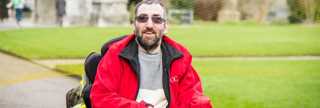 Access UCC Photoshoot - Student using a wheelchair, sunny day in the QUAD UCC