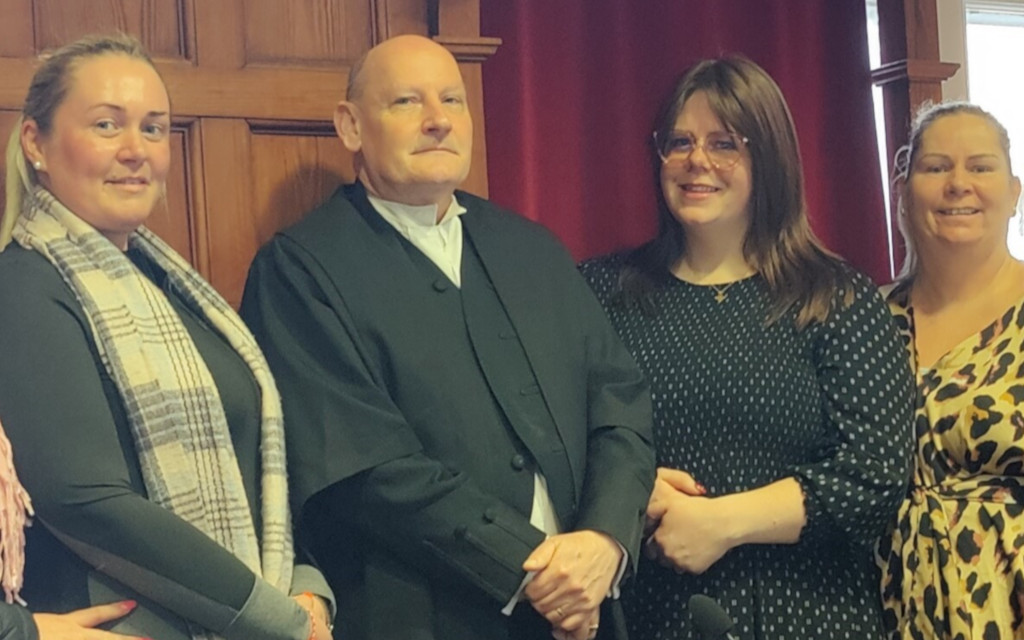 A male judge with the researcher Samantha Morgan-Williams and three other women, participants in the engaged research project