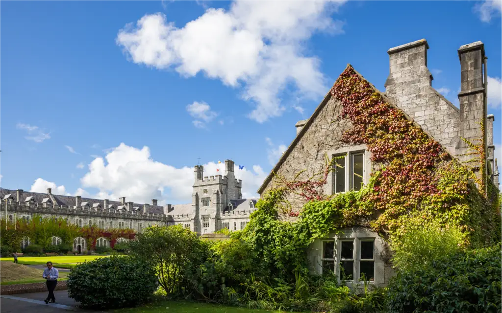 Quad with the end of the East Wing in the forefront and west wing and tower in the background