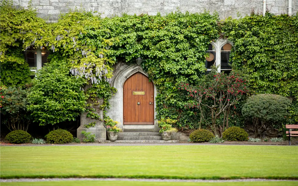 Red Door surrounded by flora in the Quad